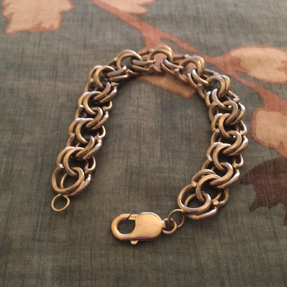 Multi link sterling bracelet .